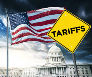 Street sign with the word tariff written on it in front of USA flag